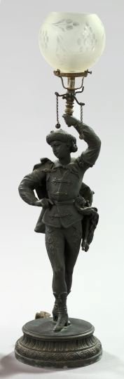 Attractive American Figural Newel Post Gas Lamp: Attractive American Bronzed Spelter Figural Newel Post Gas Lamp, fourth quarter 19th century, in the form of a Hussar holding a torch aloft, the rear edge of the waisted circular base fitted with a ga