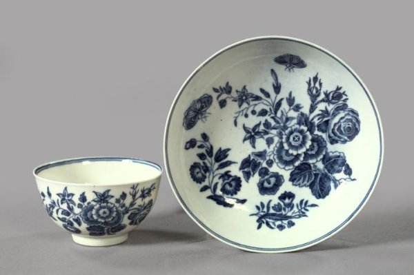 Dr. Wall Worcester Porcelain Tea Bowl and Saucer: "Dr. Wall" Worcester Blue and White Porcelain Tea Bowl and Saucer, in floral decor, 1755-1790, each piece marked on the base with an underglaze blue Worcester crescent, h. 1-3/4", dia. 5".