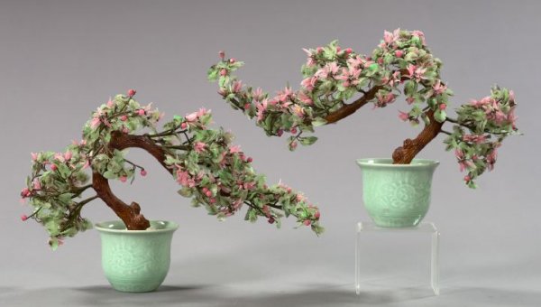 Pair of Kuang Hsu Miniature Flowering Cherry Trees: Pair of Kuang Hsu Miniature Flowering Cherry Trees, first quarter 20th century, composed of pale green and pink jade and peking glass in the Ch'ien Lung style, presented in white marble chip-filled ce