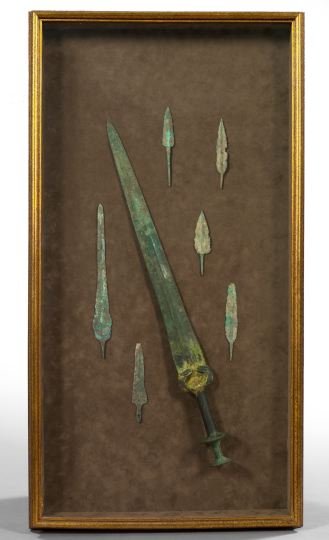 Shadowboxed Group of Oriental Weapons,: Shadowboxed Group of Oriental Weapons, including a T'ang Dynasty short sword and six spear and dagger blades, all in bronze, 618-906 A.D., presented in a giltwood shadowbox lined in brown suede and gl
