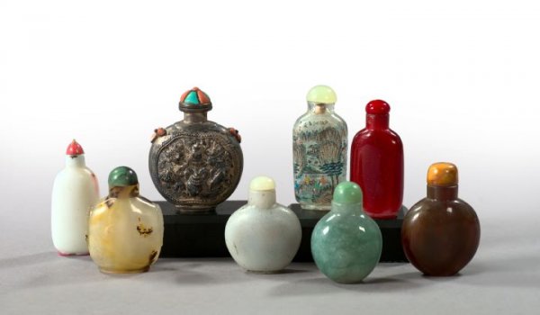 Varied Collection of Eight Kuang Hsu Snuff Bottles: Varied Collection of Eight Kuang Hsu Snuff Bottles, consisting of a coral- and turquoise-mounted silver example in "Beneficent Symbols" decor; a brown-figured "mutton fat" ring-handled bottle with a c
