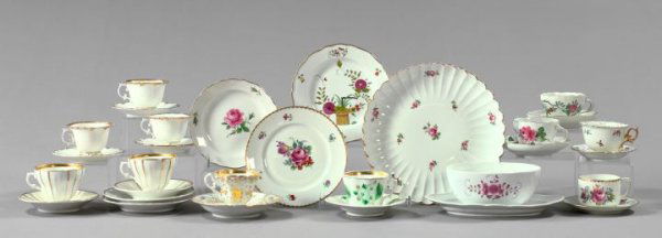 Twenty-Nine-Piece Collection of Porcelains: Interesting Twenty-Nine-Piece Collection of Porcelains, produced by Meissen, Royal Berlin (KPM) and cconsisting of a Meissen circular pastry tray of stylized flowerhead form in "Roses" decor, first qu