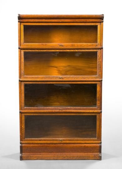 American Quarter-Sawn Oak Barrister's Bookcase: American Quarter-Sawn Oak and Oak Barrister's Bookcase, early 20th century, of four-stack form with a molded cornice and base, each section with a glazed tilting and retracting door, h. 59-3/4", w. 34