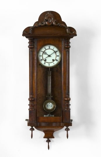 French Walnut and Walnut Burl Wall Clock,: French Walnut and Walnut Burl Wall Clock, fourth quarter 19th century, three sides glazed, retains the enamel-set brass pendulum, the circular dial of brass-banded white enamel with black chapters, h.