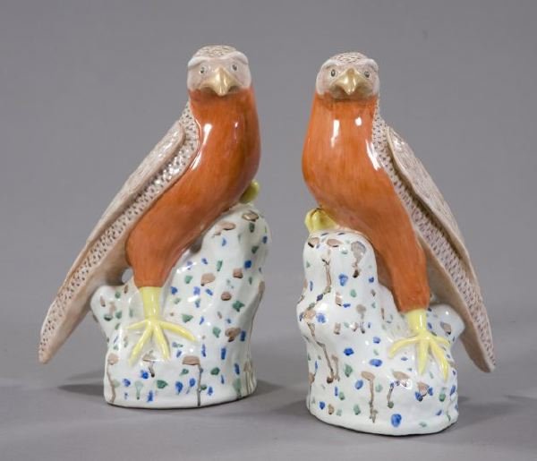 Pair of Chinese Export Porcelain Figures: Pair of Chinese Export Porcelain Figures of Hawks, 20th century, each figure standing on a dappled rockwork base, the birds with iron-red bodies and very detailed painted feathers, h. 12".