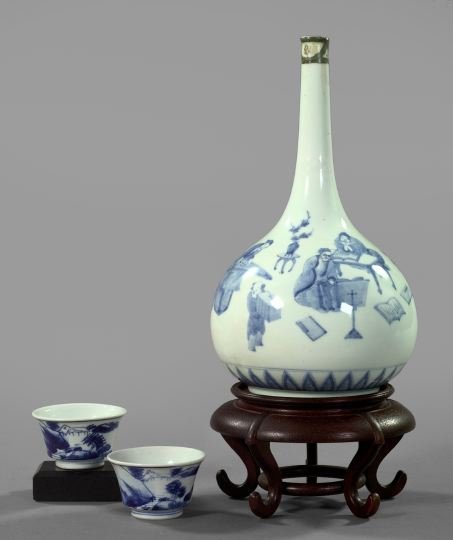 Group of Three Oriental Porcelain Items,: Group of Three Oriental Porcelain Items, consisting of a Chinese blue and white porcelain long-neck vase, in "Mandarins" decor, first quarter 19th century, presented on a Chinese cinquepodal mahogany 