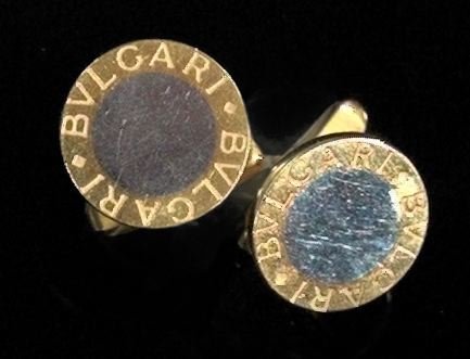 Gold Bulgari Gentleman's Cufflinks: Pair of Eighteen-Karat Two-Color Gold Bulgari Gentleman's Cufflinks, each of circular form with a white gold center with yellow gold border engraved with the Bulgari name.