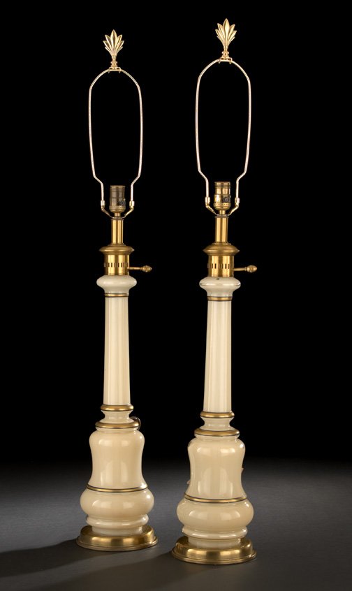 Frederick Cooper, Chicago, Eglomise Table Lamps: Pair of Frederick Cooper, Chicago, Gilt-Brass-Mounted Eglomise Table Lamps, of Napoleon III carcel form, the tall ivory eglomise standard with black and gold banding, each lamp fitted with a brass fin