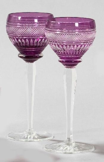 Set of Eleven Bohemian Glass White Wine Goblets: Set of Eleven Bohemian Glass White Wine Goblets, first quarter 20th century, of richly cut amethyst overlay and colorless glass, the amethyst bowls cut in "Fine Diamond" bands, the circular feet rever
