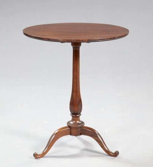 George III-Style Mahogany Tripod Table,: George III-Style Mahogany Tripod Table, early 20th century, the tilting circular top raised on a paneled bulbous standard to three splayed legs ending in scrolled toes, h. 29", dia. 24".