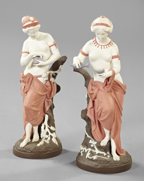 Minton Tinted Parian Porcelain Figures: Fine and Rare Pair of Minton Tinted Parian Porcelain Figures, of a bare-breasted Hebe, dresser to the gods, third quarter 19th century, one example with impressed Minton marks on the edge of the circu