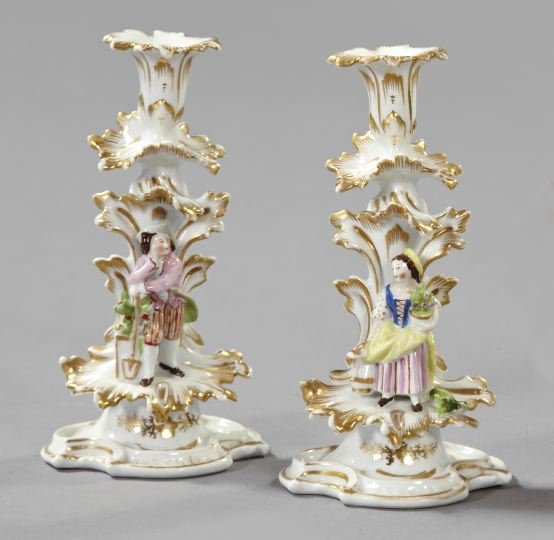Pair of White and Gold Paris Porcelain Candlestick: Pair of White and Gold Paris Porcelain Candlesticks, third quarter 19th century, each with a polychromed figure of, respectively, a Louis XV swain and and a Louis XV gardening lady at the base, h. 9-1