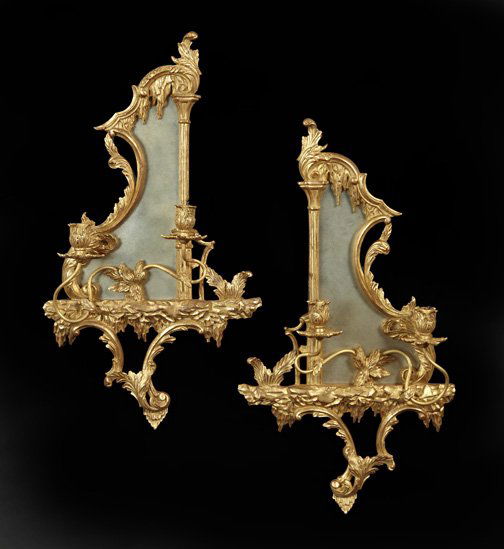 Pair of English Two-Light Girandole Sconces,: Pair of English Two-Light Girandole Sconces, composed of carved giltwood and mirrored glass in the manner of Thomas Johnson (1714-1778), the giltwood candlesockets of tulip form and supported on curvi