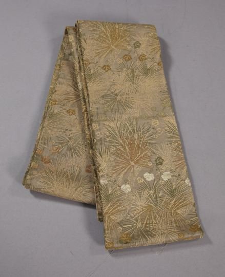 Japanese Meiji Silk Damask Winter Obi: Japanese Meiji Embroidered and Appliqued Silk Damask Winter Obi, first quarter 20th century, the gray-brown silk ground having an overall pattern of gold and silver pine needles and vines, w. 6-3/4", 