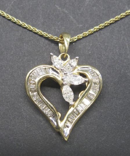Gold and Diamond Heart-Shaped Pendant and Chain: Fourteen-Karat Yellow Gold and Diamond Heart-Shaped Pendant and Chain, the heart-shaped pendant set with baguette-cut white diamonds and a cluster of four marquise-cut white diamonds with an estimated