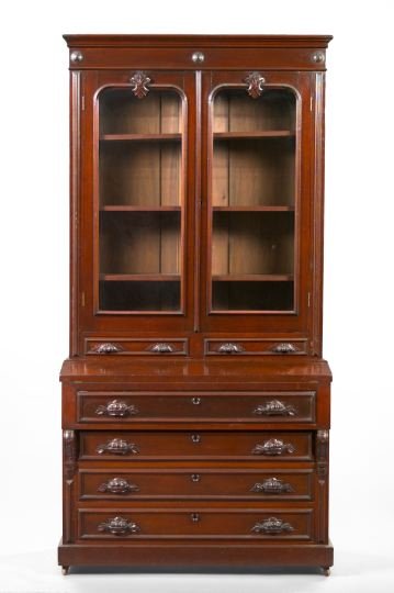 American Renaissance Revival Walnut Secretary: American Renaissance Revival Walnut Secretary Bookcase, late 19th century, in two parts, the upper section with a molded cornice over a pair of glazed doors, each with a carved cartouche above the gla