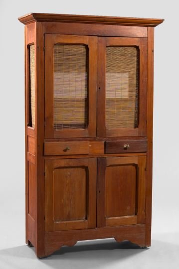 American Cypress and Pine Kitchen Cupboard: Vernacular American Southern Cypress and Pine Kitchen Cupboard, ca. 1900, the projecting molded cornice over two sets of doors bisected by a pair of drawers, the lower drawers fitted with panels, the 