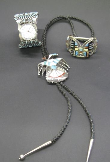 Three Navajo and Zuni Silver Jewelry Items,: Three Navajo and Zuni Silver Jewelry Items, including a vintage Navajo silver cuff bracelet, set with a total of eighty-eight turquoise cabochons and displaying a Timex watch face, stamped "F.M. BEGAY