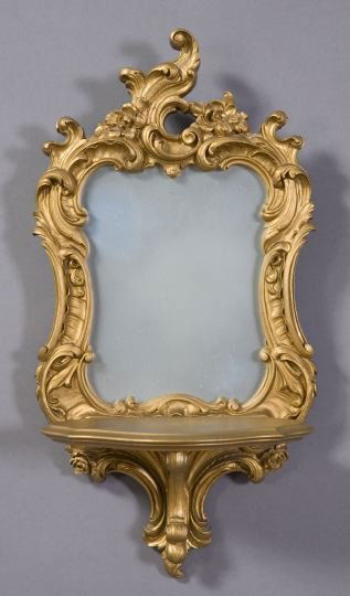 Continental Giltwood and Mirrored Bracket Shelf: Continental Carved Giltwood and Composition Mirrored Bracket Shelf, in the rococo taste, the serpentine-front bracket shelf supported on a giltwood foliate scroll, h. 21", w. 11", d. 6-1/4".