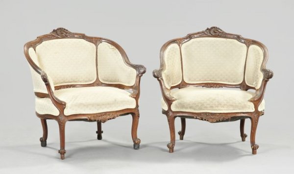 Pair of Louis XV-Style Walnut Bergeres,: Pair of Louis XV-Style Walnut Bergeres, fourth quarter 19th century, the shaped padded back above a conforming carved crest, centered by acanthine carving, joined to the like seat by closed outscrolle