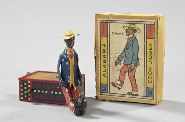 Lehmann, Germany, "Coon Jigger" Automaton: Boxed Lehmann, Germany, Novelty Painted Metal "Coon Jigger" Automaton, first quarter 20th century, featuring a dancing black man, presented in the period lithographed card box, h. 10-1/4".
