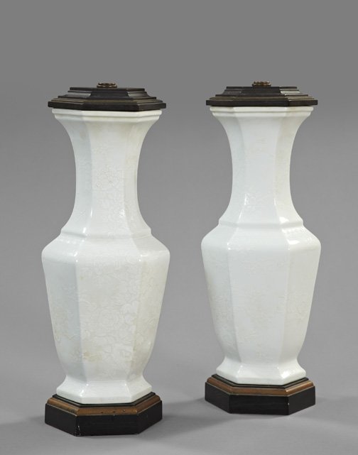 Kuang Hsu "Damask" Porcelain Lamps: Pair of Kuang Hsu Blanc-de-Chine "Damask" Porcelain Vases, first quarter 20th century, of paneled hexagonal form, now mounted as table lamps on conforming parcel-gilt satin black-finished wooden bases