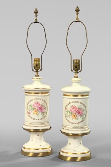 French White and Gold Porcelain Table Lamps: Pair of French White and Gold Porcelain Table Lamps, second quarter 20th century, of footed Carcel form in the Napoleon III style, each facade with a gilt-framed tondo of polychromed summer flowers, e