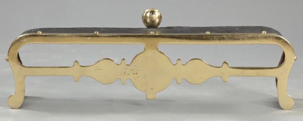 English Brass and Cast-Iron Fire Fender,: English Brass and Cast-Iron Fire Fender, first quarter 19th century, the heavy brass front with pierced design, mounted to a curved base, h. 14-3/4", w. 43", d. 8-1/2".