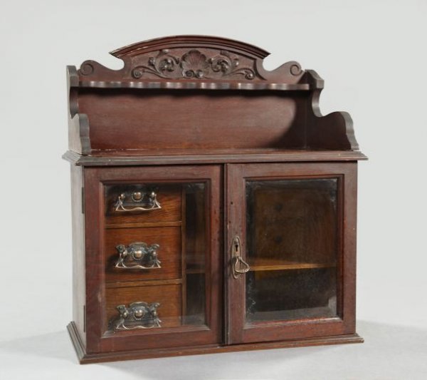 Edwardian Mahogany and Oak Hanging Cupboard: Edwardian Rose-Copper-Mounted Mahogany and Oak Hanging Cupboard, first quarter 20th century, with glazed doors, the interior fitted with a trio of stacked small drawers flanking a single transverse sh