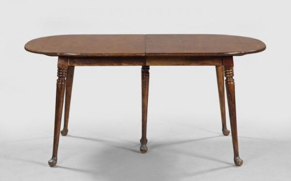 American Colonial Revival Stained Maple Table: American Colonial Revival Stained Maple Dining Table, of Queen Anne inspiration, the top opening to accommodate a single leaf, raised on turned legs with pad feet, h. 29", w. 63", d. 42", extended l.