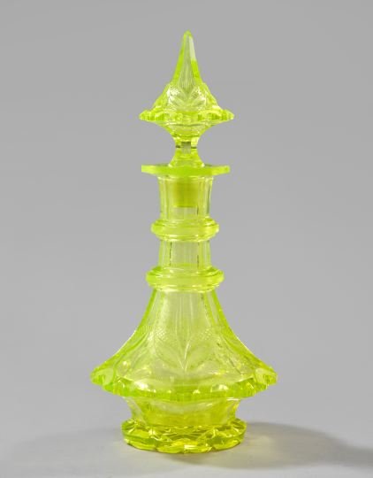 Russian Cut Uranium Glass Decanter: Fine, Rare and Large Russian Cut Uranium Glass Decanter, second quarter 19th century, retains the tall cut "coolie hat" glass stopper, h. 15-1/2".