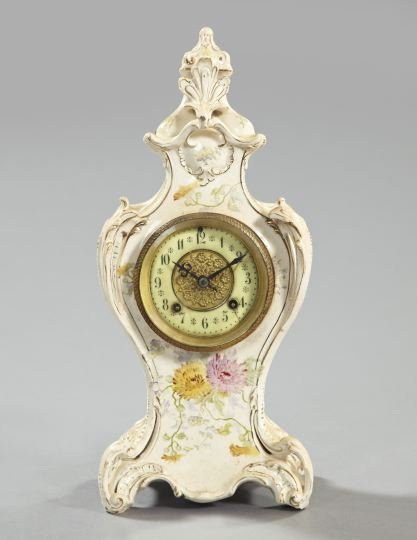 American Eight-Day Porcelain Mantel Clock,: American Eight-Day Porcelain Mantel Clock, first quarter 20th century, by the New Haven Clock Company, the soft paste porcelain case in the Louis XV style, the movement strikes on the half hour, h. 16