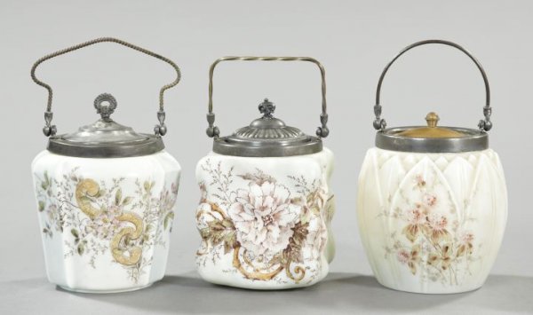 Collection of Three Wavecrest Glass Biscuit Jars: Collection of Three "Wavecrest" Glass Biscuit Jars, all fourth quarter 19th century, by the C. F. Monroe Company, consisting of one barrel-form example with bas-relief upright leaves; one puffed examp