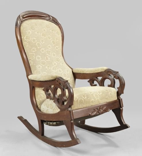 American Rococo Revival Walnut Rocking Chair: American Rococo Revival Walnut "Lincoln" Rocking Chair, third quarter 19th century, the molded and carved frame featuring scroll-cut and carved arms, the seat apron with applied foliate carving, h. 42