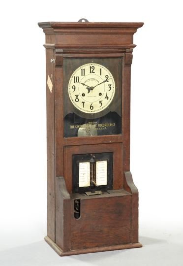 Rare American Late Victorian Oak Time Clock,: Rare American Late Victorian Oak Time Clock, ca. 1900, the door stenciled "Made by the Cincinnati Time Recorder Co.", h. 46", w. 19-3/4", d. 11-3/4".