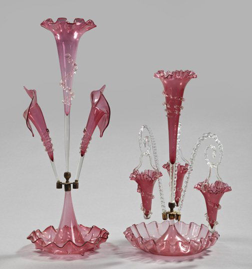 Group of Two Glass Epergnes,: Group of Two Glass Epergnes, fourth quarter 19th century, one a tall English brass-mounted colorless and cranberry glass three-trumpet epergne, the side trumpets of "Jack in the Pulpit" form, h. 24-1/
