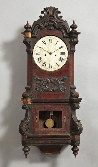 Continental Rosewood-Grained Mahogany Wall Clock: Continental Rosewood-Grained Mahogany Wall Clock, third quarter 19th century, of large size in the rococo taste, the cresting modeled as a group of tangent foliate scrolls between a pair of upright st