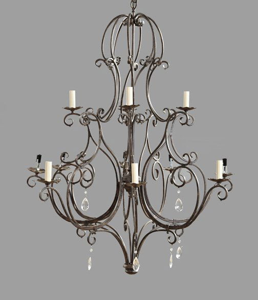 French Provincial Wrought-Iron Chandelier: French Provincial Wrought-Iron Twelve-Light Chandelier, in the Louis XV taste, of large size, the tiered candlearms modeled as foliate scrolls and dressed with faceted drops of tear form, electrified