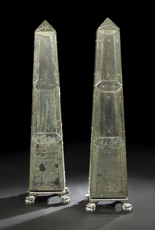 Large Pair of Mirrored Obelisks,: Large Pair of Mirrored Obelisks, each of traditional form and composed of mirrored panels, raised on a square base ending on argente paw feet, h. 72-1/2", w. 18", d. 18".