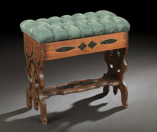 American Ebonized and Gilt-Incised Walnut Stool: American Ebonized and Gilt-Incised Walnut Stool, third quarter 19th century, the tufted forest brocade cushion lifting to reveal a storage compartment, on a trestle-form base, the supports adorned wit