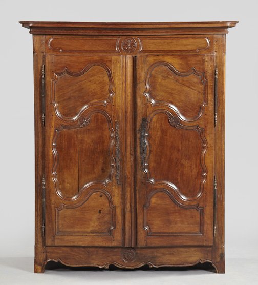 French Provincial Oak Armoire,: French Provincial Oak Armoire, mid-19th century, the mounted and molded cornice above a conforming case fitted with a paneled frame over two doors, each inset with three shaped panels, over a shaped a