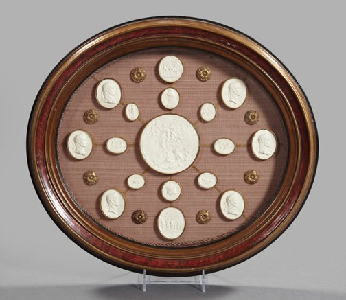 Collection of Seventeen English Plaster Intaglios: Handsome Shadowboxed Collection of Seventeen English Plaster Intaglios, first quarter 19th century, taken from ancient Roman gems or medallions, presented on a corded "vieux rose" strie silk backplate
