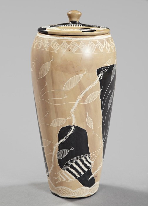 Kenyan Parcel-Ebonized Ecru Soapstone Vase: Stylish Kenyan Parcel-Ebonized Ecru Soapstone Covered Vase, of baluster form, incise carved with fish, foliage and eels, h. 14-1/2", dia. 7-1/4".