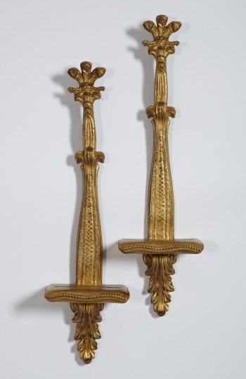 Italian Antiqued Giltwood Bracket Shelves: Pair of Italian Carved and Antiqued Giltwood Bracket Shelves, in the Empire taste, the oblong shelves of stylized pillow form, each fitted with a plate slot, h. 26", w. 7", d. 3-3/4".