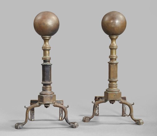 American Cast Brass "Cannonball" Andirons: Stately Pair of American Cast Brass "Cannonball" Andirons, first quarter 20th century, in the Colonial style, supported on ball-and-claw feet and wrought-iron billets, h. 22", w. 12", d. 7"