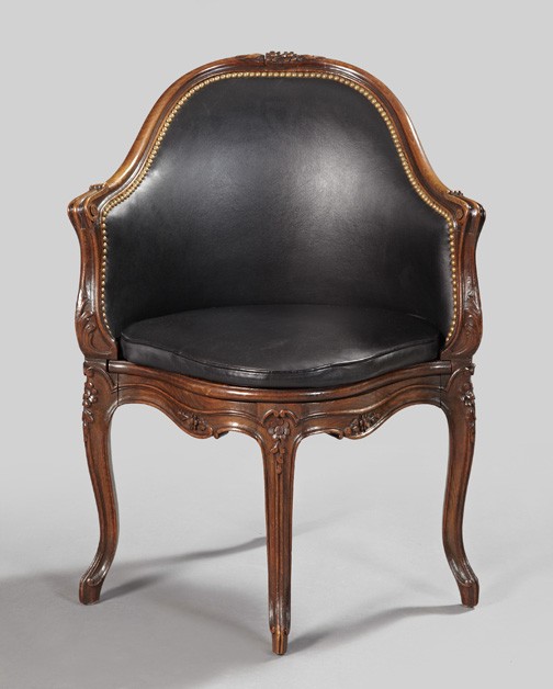 Louis XV-Style Walnut Bergere en Encoignure,: Louis XV-Style Walnut Bergere en Encoignure, fourth quarter 19th century, the slightly domed crest centered by a floral-spray carving, above a conforming padded back joined to the cushioned seat by li
