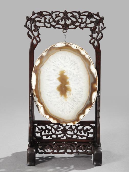 Kuang Hsu Hardwood Scholar's Desk Frame: Kuang Hsu Hardwood Scholar's Desk Screen Frame, the elaborately carved and pierced frame first quarter 20th century, now mounted with an oval caramel and white polished geode slice, h. 18", w. 8-3/4",