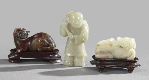 Three Chinese Carved Jade Figures,: Three Chinese Carved Jade Figures, 19th century, comprised of a pale green figure of a child, a white jade figure of a horse and a brown jade figure of a lion; the largest h. 3", l. 2-1/2" to 2-3/4".