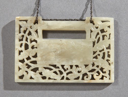 Chinese Carved White Jade Pendant Plaque,: Chinese Carved White Jade Pendant Plaque, ca. 1920, in the shape of a rectangular lock, with a central landscape scene surrounded by a pierced floral border, now suspended on a chain, h. 2", w. 3".