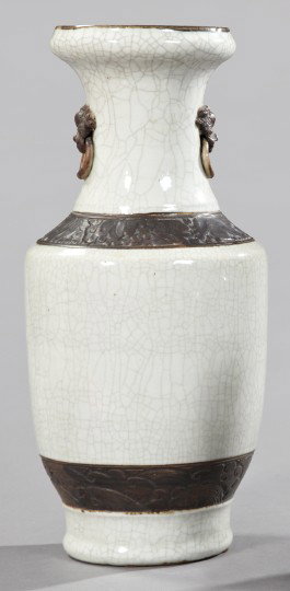 Kuang Hsu Porcelain Vase,: Kuang Hsu Porcelain Vase, fourth quarter 19th century, of tall baluster form and having a white crackle glaze with dark bronze detailing, the waisted neck with a bronzed ringed Foo-dog masque at eithe